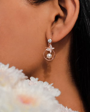 Rose Gold Butterfly Pearl Drop Earrings.